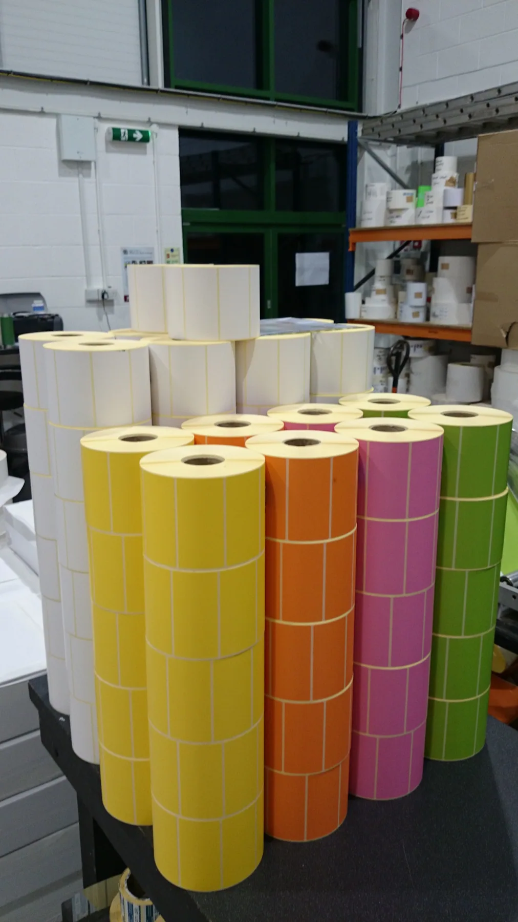 Real collection of brightly coloured label rolls