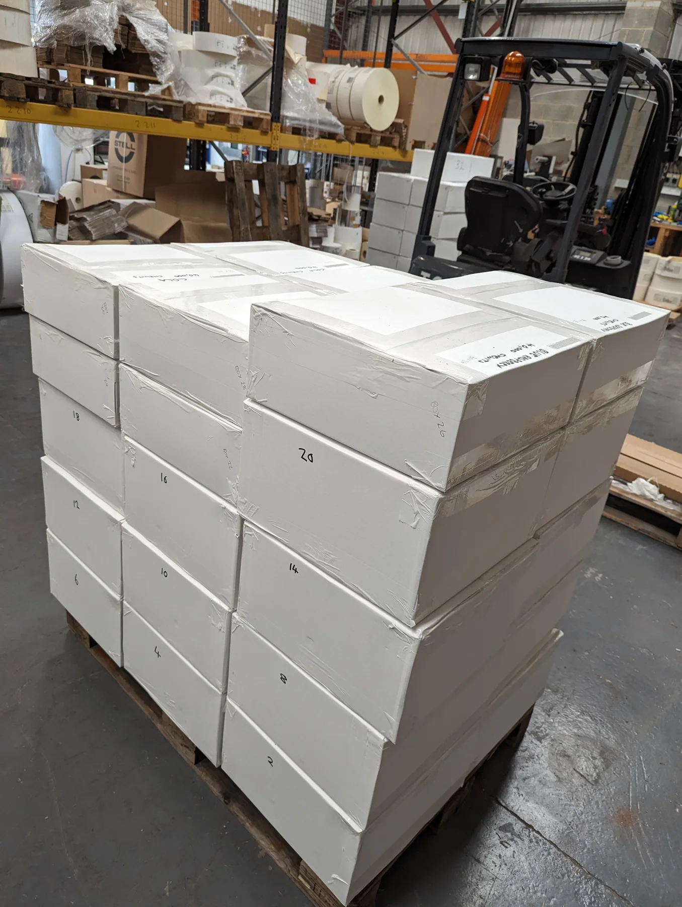 Genuine cartons stacked in the Northern Labels packing area