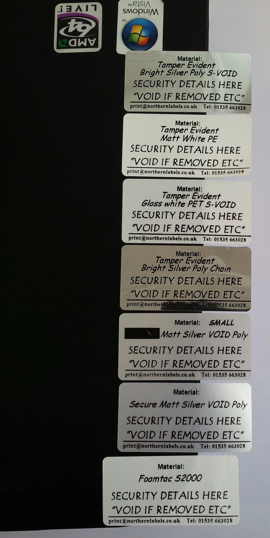 Real preprinted identification labels oriented along a continuous web