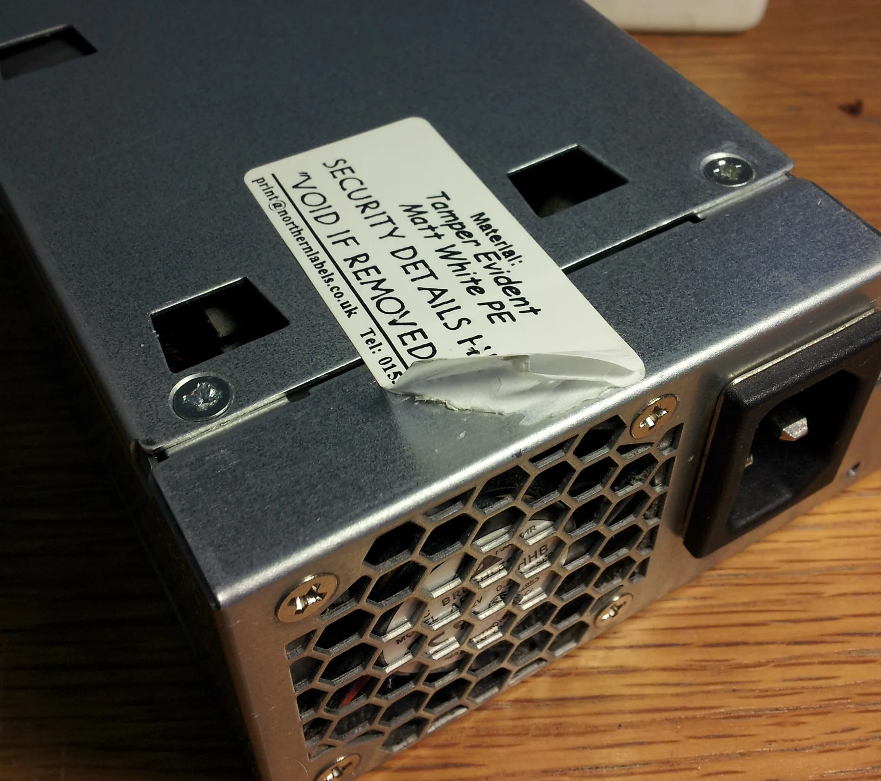 Actual security label fitted to a power-supply casing