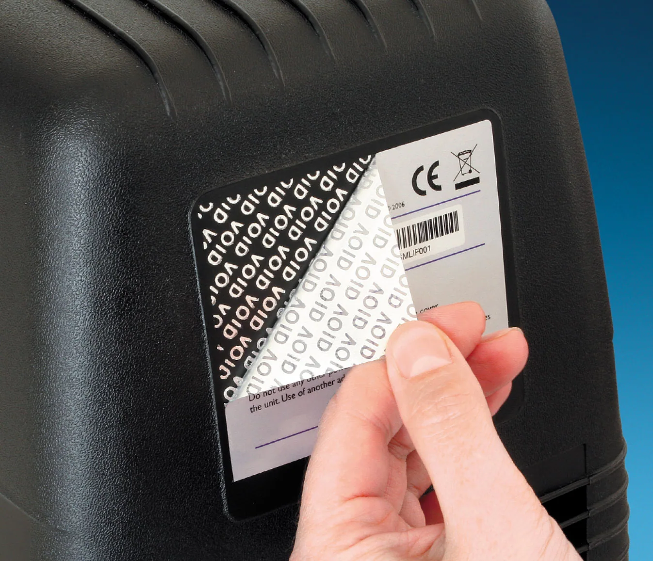 Tamper-evident VOID label separating from its backing